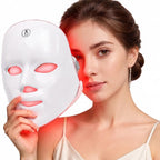 Woman holding the LumiGlow LED mask glowing red