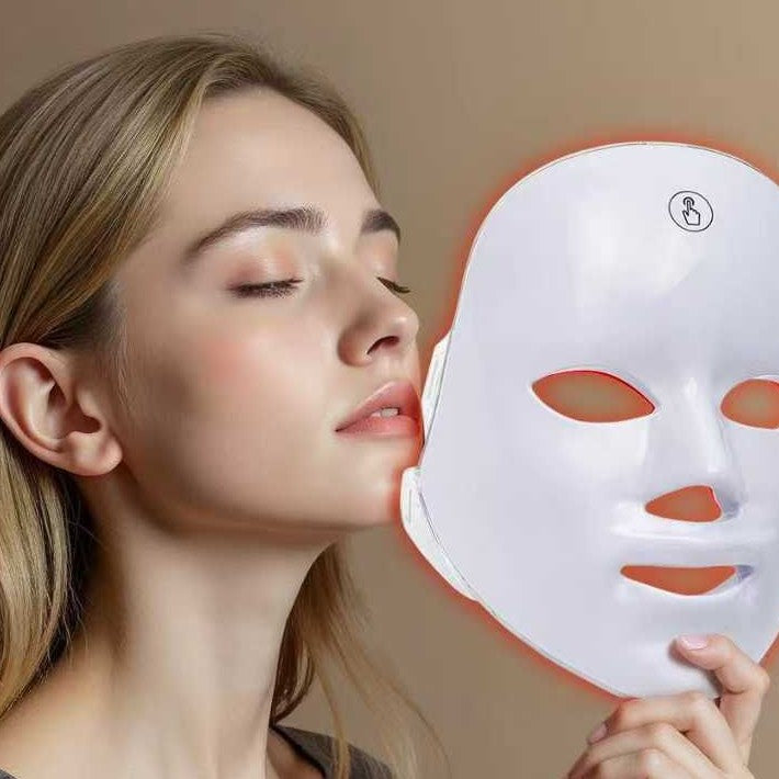 Woman relaxing with eyes closed next to the LumiGlow LED mask