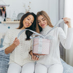 Two friends opening a LumiGlow gift box