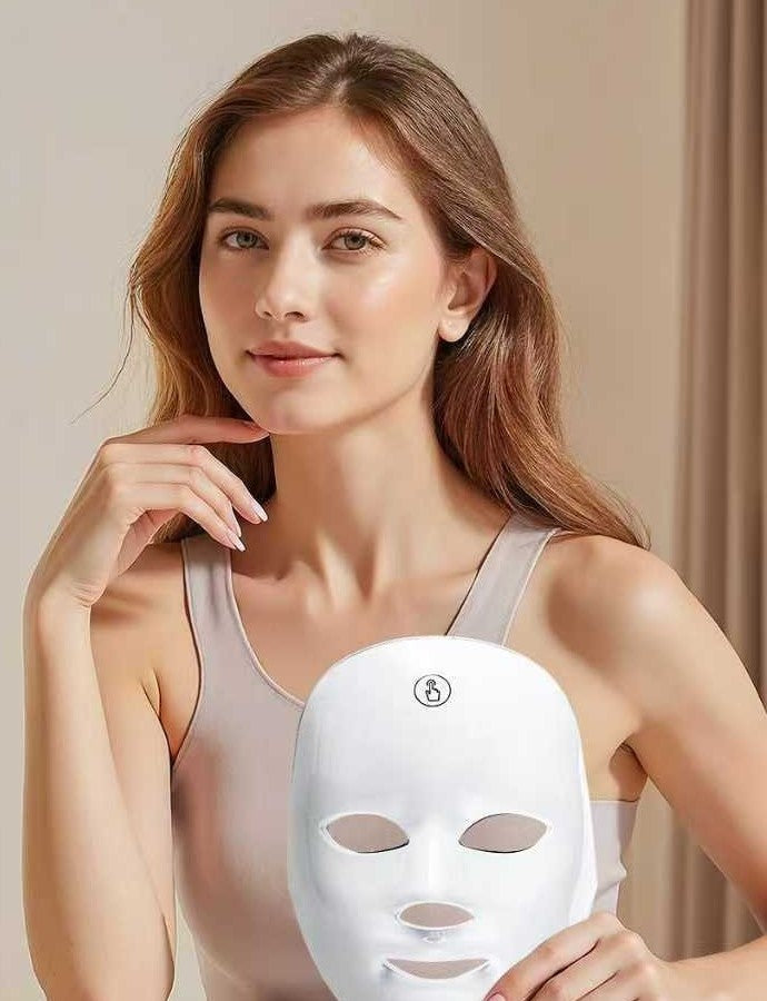 Woman holding the white LumiGlow LED face mask